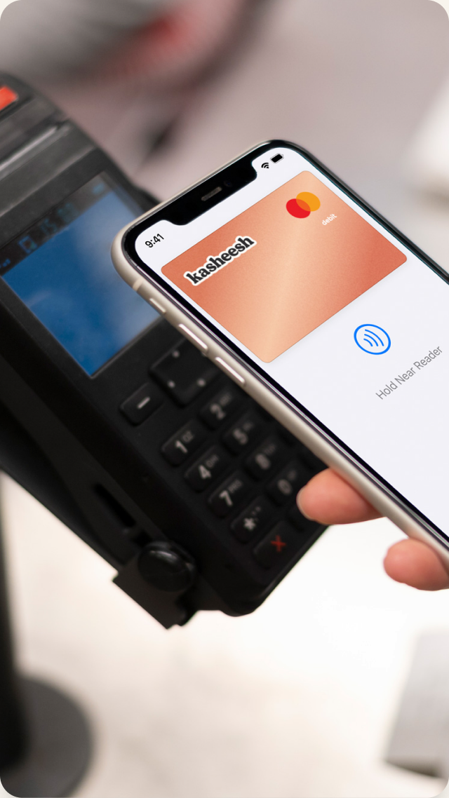 Phone tapping a payment terminal with the Kasheesh card